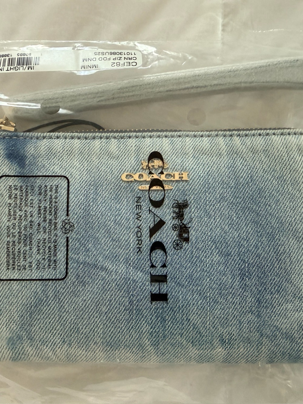 Coach Outlet Corner Zip Wristlet In Loved Denim With Charms